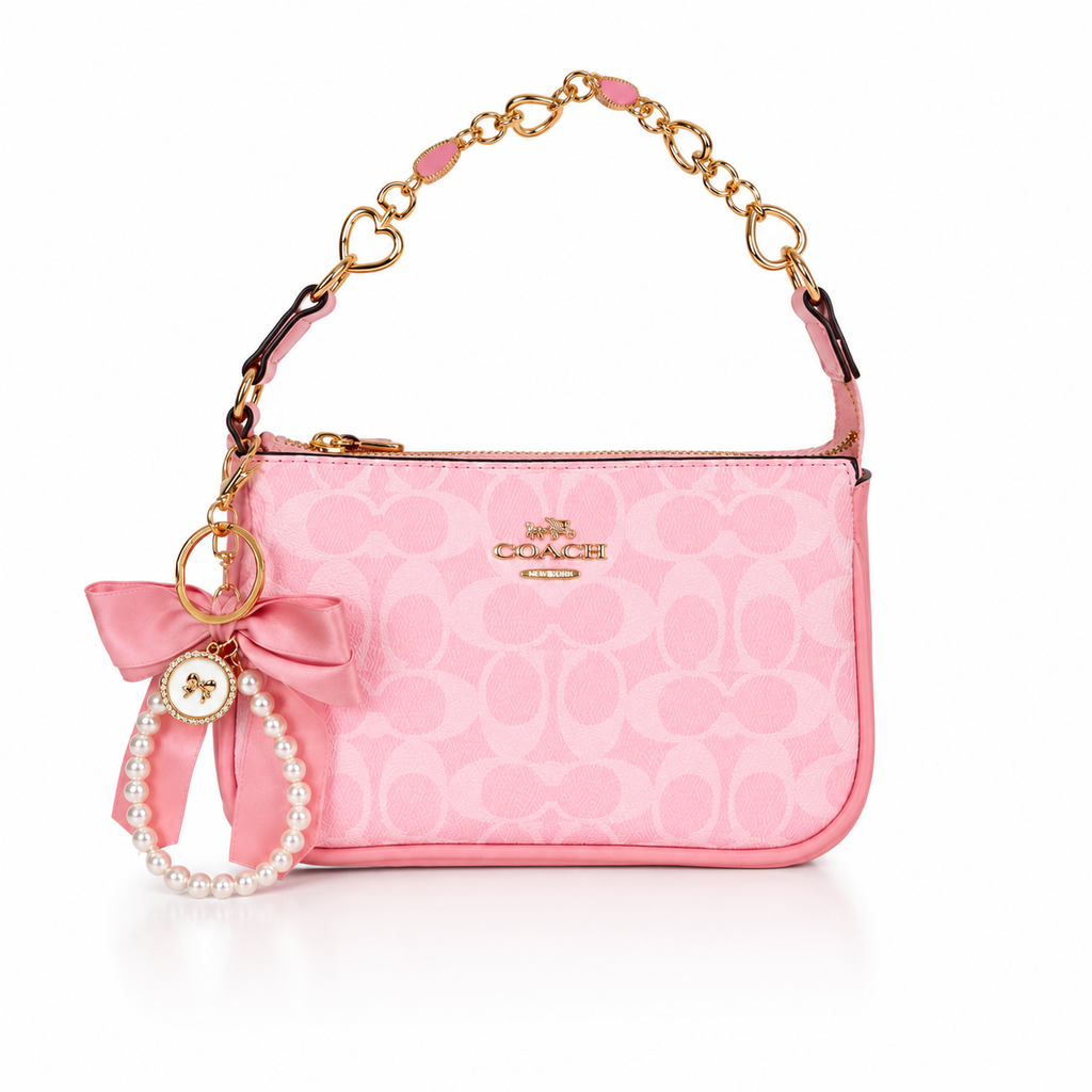 Coach Nolita Signature Canvas Shoulder Bag in Pink with Gold Chain Strap & Pearl Bow Charm